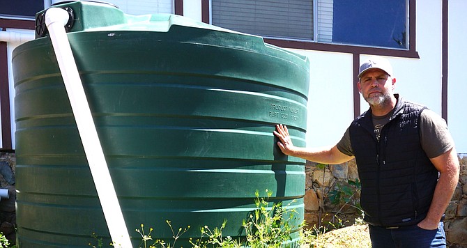 Chris Baron at his friend's house. 1320-gallon containers.