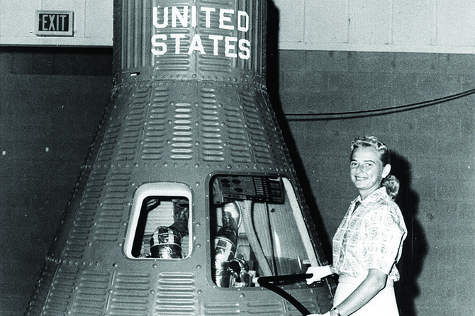 Jerrie Cobb next to the Mercury capsule