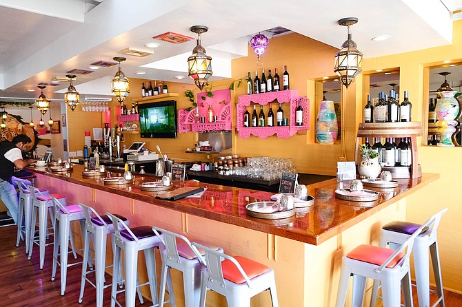 A colorful bar space anchors Curryosity.