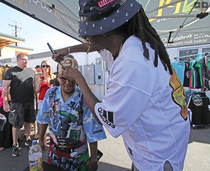 Snoop was stoked when he saw Z’s get-up and he signed his hat and the shirt on his back and took a photo with him. “I’ve been wanting to meet him for a long long time,” Z-MAN said.