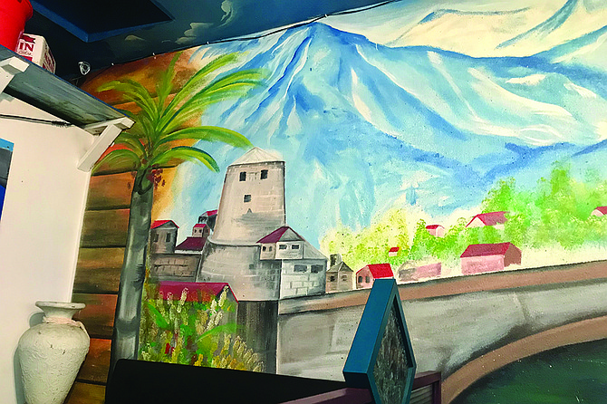 Memories of home: The legendary bridge at Mostar, a mural on Arslan’s wall