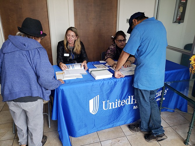 UnitedHealthcare employees Bea Serrano and Melissa McIntyre assist community members with their Medicare and Medi-Cal questions.