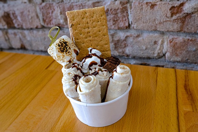 Thai rolled ice cream modeled after s'mores, with chocolate, graham cracker, and a scorched marshmallow