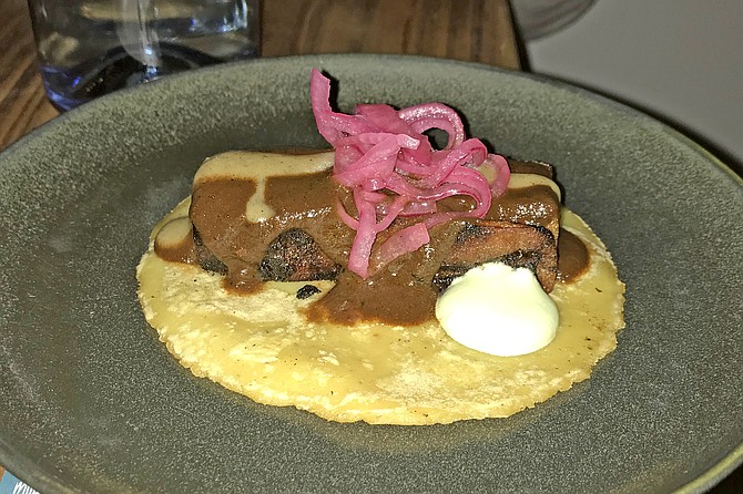 Black (chocolate) mole turns this pork belly negro taco into something sweet, special