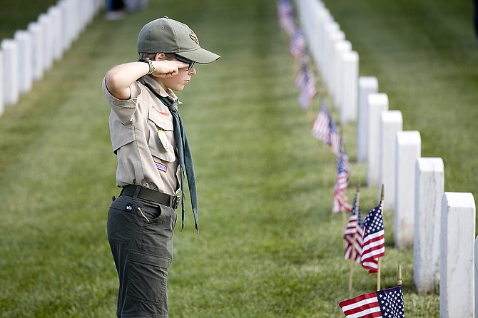 Encintas Troop 2000 Boy Scout, Miles Ullrich, placing flags at Fort Rosecrans National Cemetery