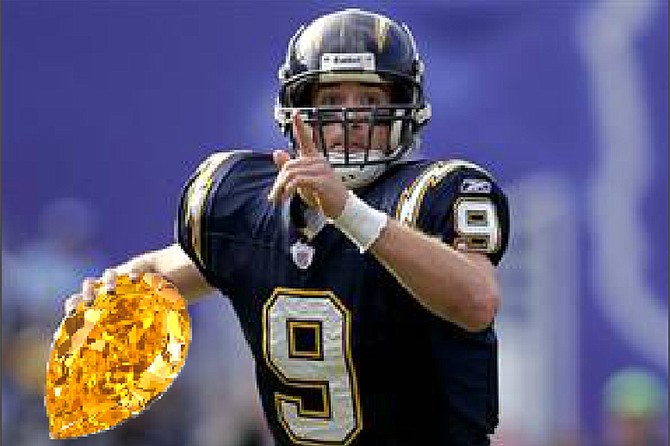 Tripped up: Drew Brees, shown here in happier times. wearing Charger Blue, holding up a finger indicating his future as the number one passer of all time, and carrying a yellow diamond he thought was a lot more valuable than it turned out to be.