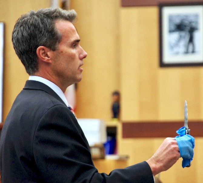 Prosecutor Cal Logan showed the knife to the jury, during trial.