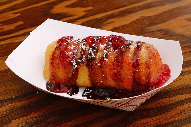 At the fair, a chocolate and strawberry fried Twinkie seems quaintly simple.