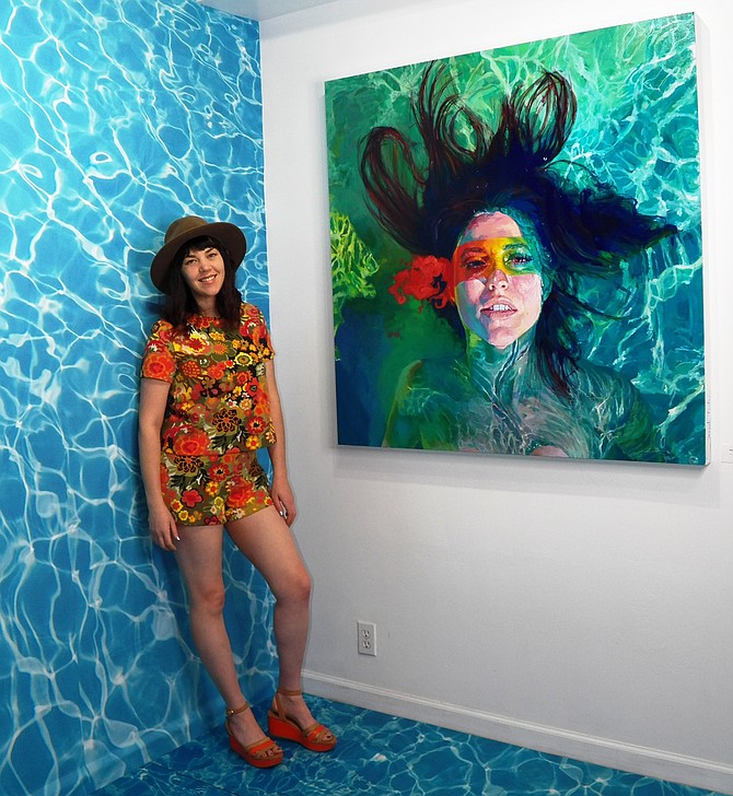 Sarah Stieber at Mee Shim Fine Art beside her FACE IT self-portrait