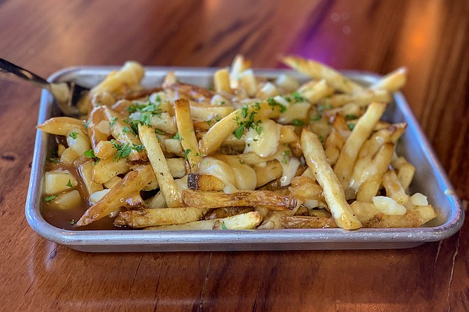 Brown gravy and cheese curds make these fries French-Canadian.
