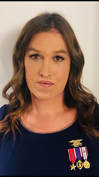 Kristin Beck, complete with SEAL insignia and medals