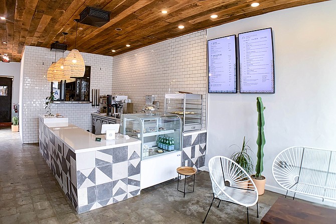 A simple, stylish counter shop serving empanadas and a litany of yerba drinks
.