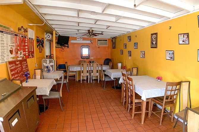 Casual Rincon Azteca dining room, with mismatched dining furniture and pretty tablecloths