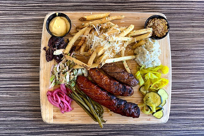 A chef's board of house-made game sausage