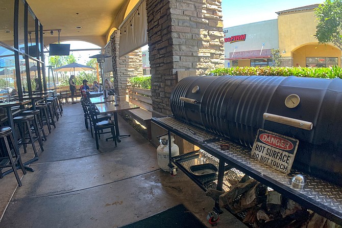 A smoker on a dining patio in East County