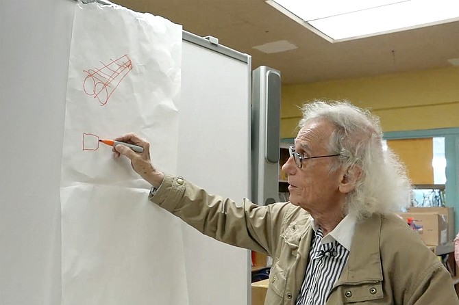 Walking on Water: Super-scale artist Christo demonstrates his vision to a group of schoolchildren.