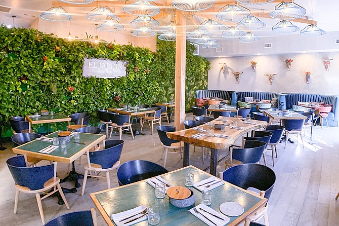 Most of El Jardin's tables are outdoors, but the dining room is colorful and creative.