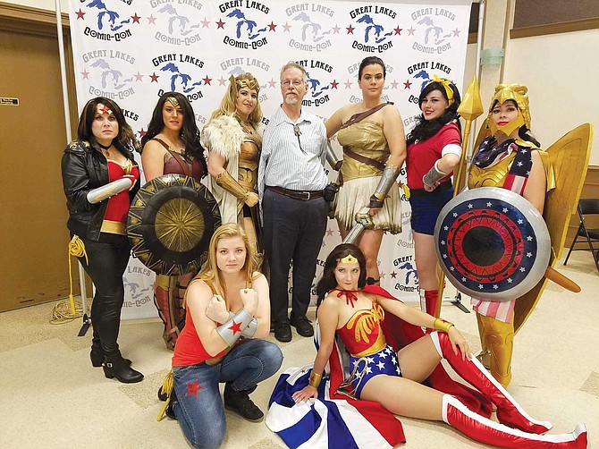 Bill Messner-Loebs (center) with Wonder Woman cosplayers at the Great Lakes Comic-Con.