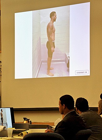 Kellen Winslow Jr looks up at one of the arrest photos of himself, displayed for the jury.