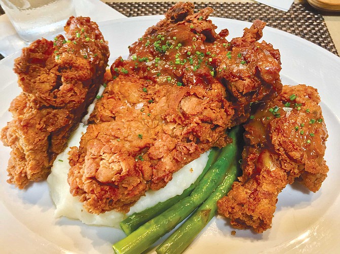 Cowboy Star’s buttermilk fried chicken: the deeply browned, pebbly crust shatters perfectly bite after bite, revealing the sweet, juicy meat underneath.