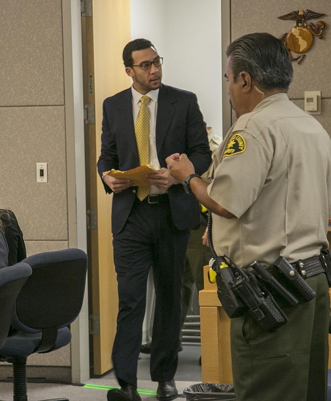 Defendant Winslow greets his father each time he enters the room. Photo by John Gibbins.