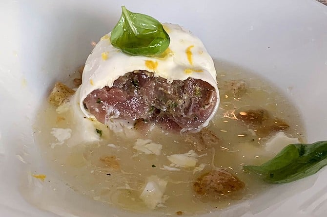 Mozzarella di tonno, cut open to reveal tuna tartar within the burrata