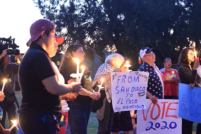 Attendees at the vigil in memory of the El Paso shooting victims