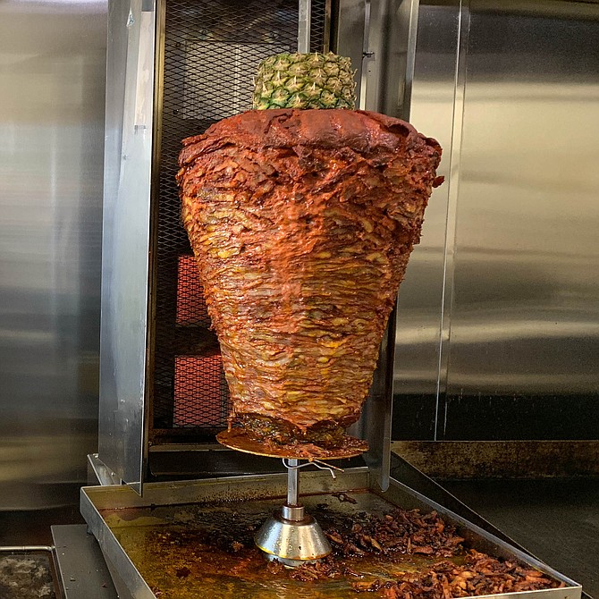 The trompo at the center of Tacos El Trompo