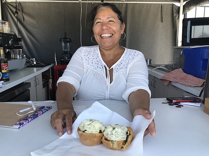 Maria Lopez with the week’s last two Oxford-style meat pies