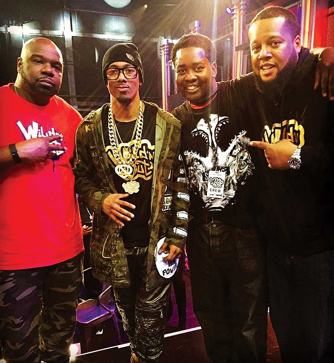 Nick Cannon, host of the VH1 show Wild ‘N Out (second from left), with Jason Crawford (second from right). According to students, Crawford would often talk about his connection to Cannon.