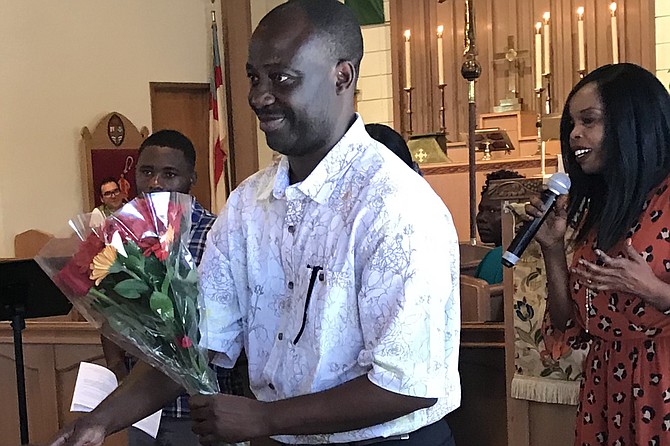 Constantin Bakala accepts welcoming flowers in St Luke’s Episcopal Church