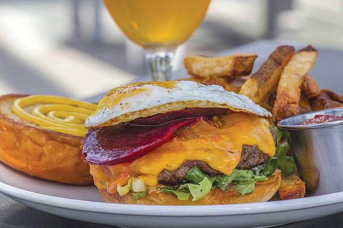 The Kairoa Kiwi burger is topped with housemade tomato chutney and marinated beets — rather than ketchup and a pickle — and a fried egg.