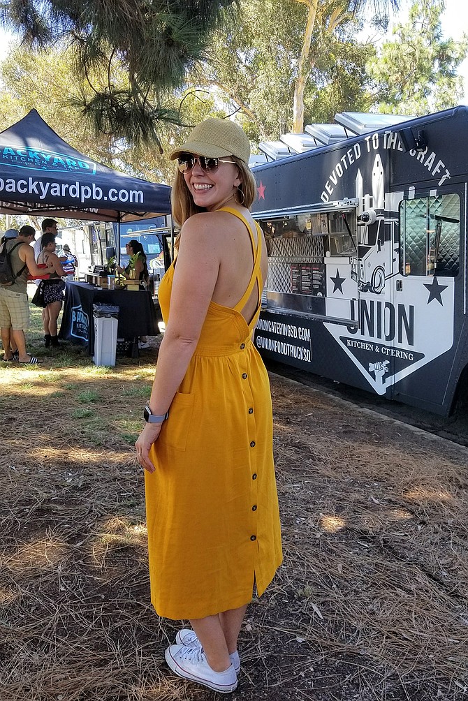 Alana's summer style includes an apron dress with a twist