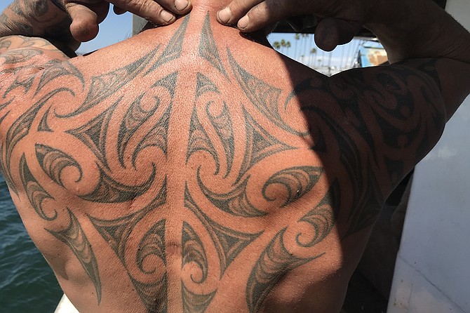 Captain Pete Bethune shows his moko - Maori tattoo - showing his whakapapa - genealogy - through symbols