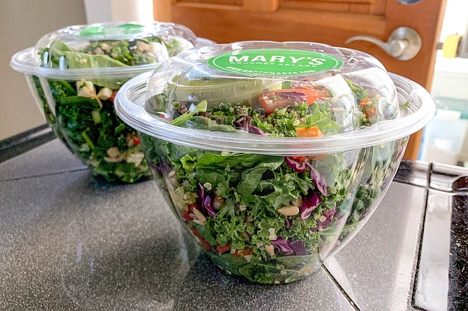 Two packaged salads delivered by Mary’s Gourmet Salads