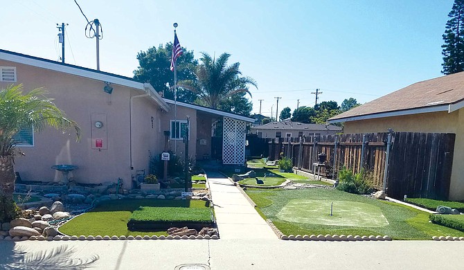 Another University Park homeowner has turned his entire front yard into a miniature golf course.