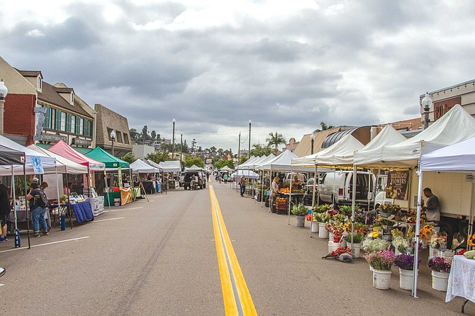 On Friday afternoons, a block-long stretch of La Mesa Blvd. in the Village is given over to a small farmer’s market.