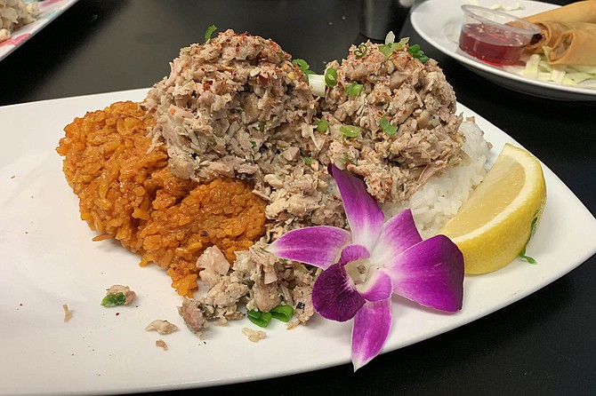Chicken kelaguen served over scoops of both red and white rice