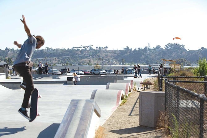 The Oceanside Skate Park. Skaters and skydivers sharing air space.