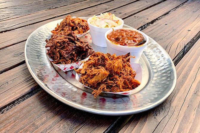 The Up in Smoke Sampler: braised chicken, pulled pork, and chopped brisket, with two sides