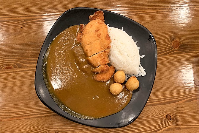 Chicken katsu and fried quail eggs with curry and rice