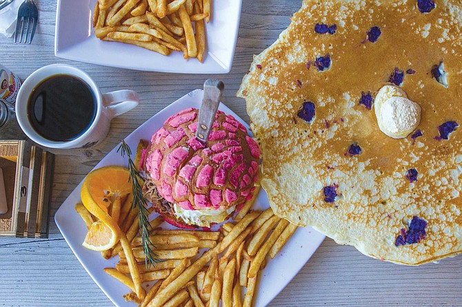 At Mexipino Craft, pancakes are given color not with blueberries, but with pieces of the purple yam ube, and the breakfast sandwich is served on a pink concha.