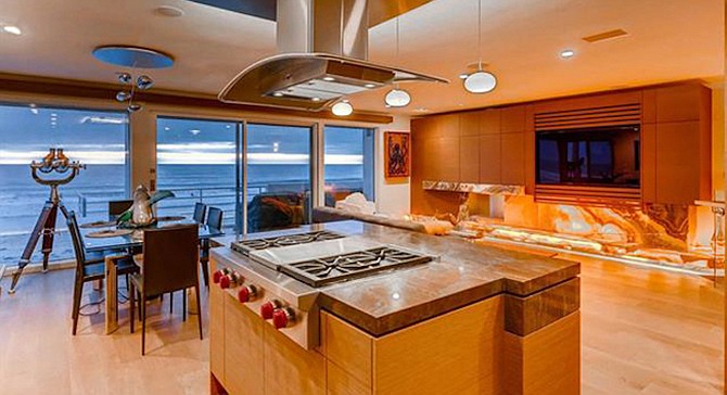 Kitchen at 1750 Ocean Front with roll-up storm windows.