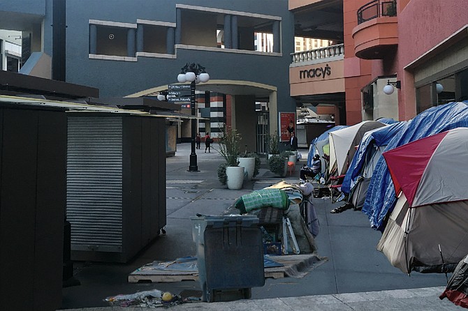Artist’s rendering of Macy’s future neighbors, should it fail to make way for proposed tech campus at Horton Plaza. “Is this the kind of hobo chic that’s good for the Macy’s brand?” asked Mayor Faulconer as he presented the image. “Because we’ve got plenty here in San Diego, and we’re happy to share.”