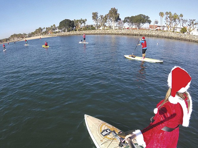 Don your Santa hat and your light-up Christmas earrings to paddle around Mission Bay with other holiday revelers.