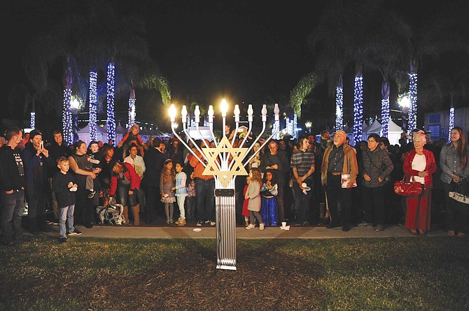 Liberty Station marks the humble Hanukkah holiday with a menorah lighting and festival on the Central Promenade.