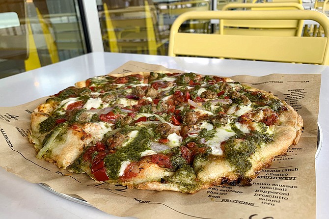 Chicken sausage and roasted red peppers on tomato sauce base with fresh mozzarella and pesto drizzle.