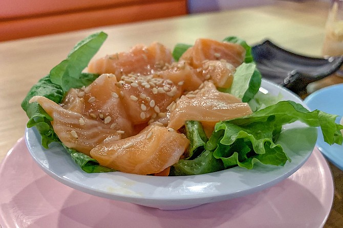 Salmon sashimi plucked from a Mikami Revolving Sushi conveyor belt