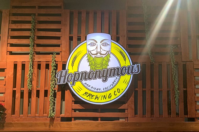 The "Anonymous" Guy Fawkes mask gets a hop beard for the Hopnonymous logo.