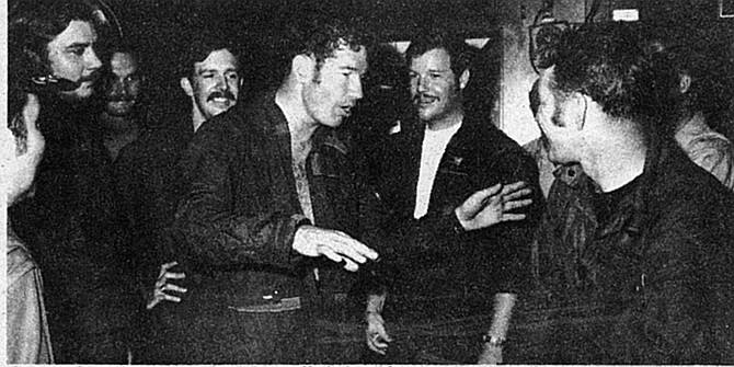 Cunningham (gesturing) and Driscoll (behind him) recounting the Col. Tomb battle, U.S.S. Constellation, May 10, 1972